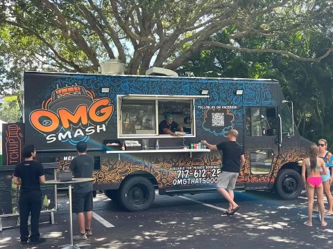 OMG Smash food truck serving guests at an outdoor event